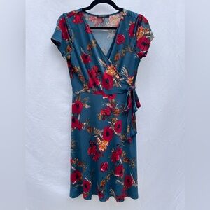 Faux wrap teal dress with red floral pattern